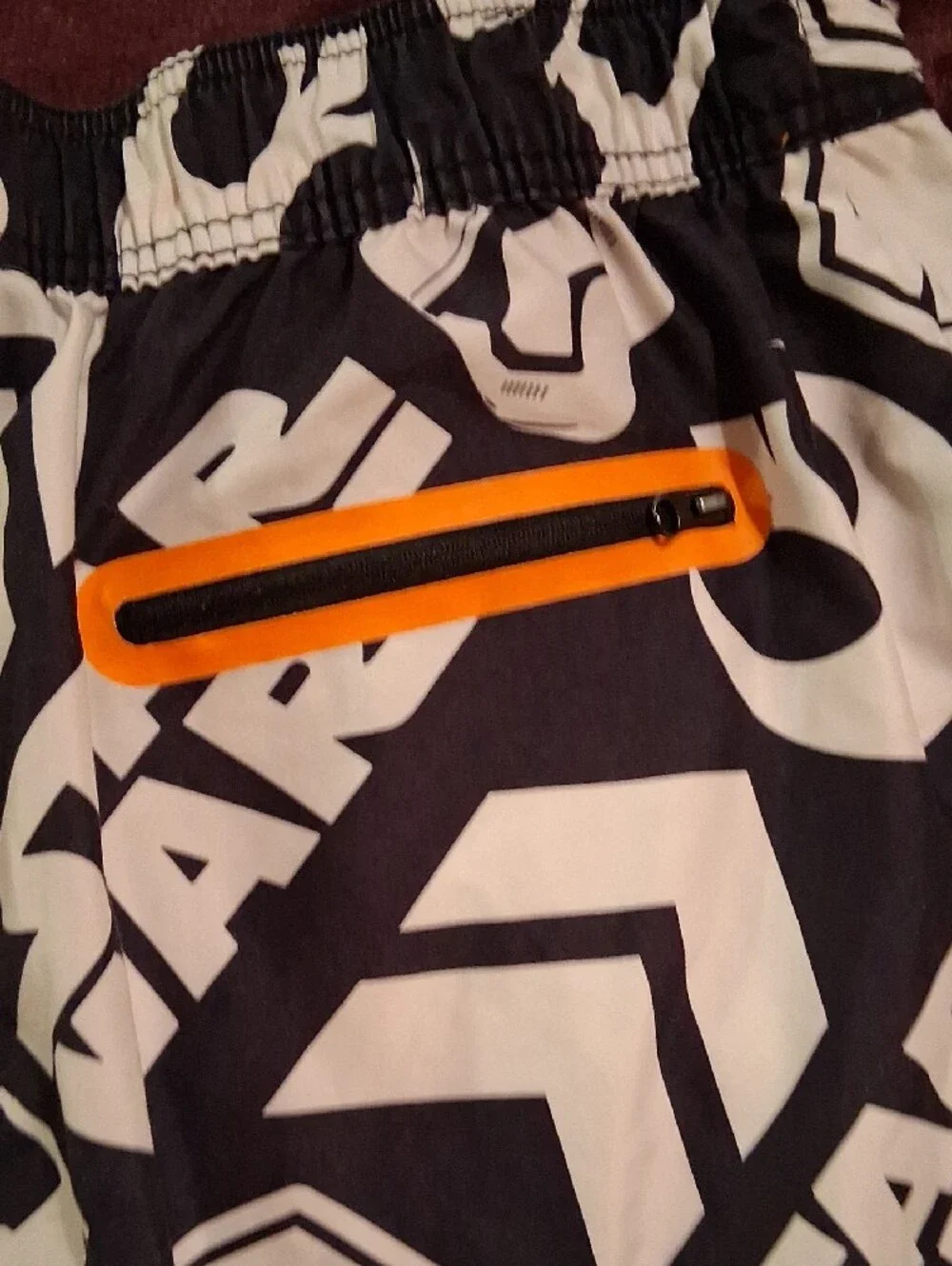 Star Wars Men’s Black and White Graphic Swim Board Shorts with Orange Drawstring